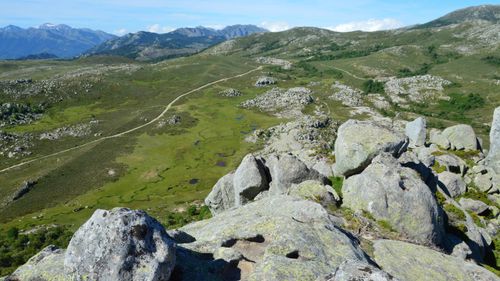 Free Expansive view of rocky hills and green valleys in Aullène, Corsica, on a clear day. Stock Photo