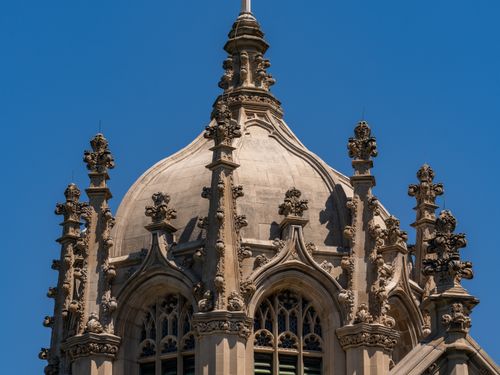 Free Close-up of a Gothic architecture dome in New York, showcasing intricate design under a clear blue sky. Stock Photo