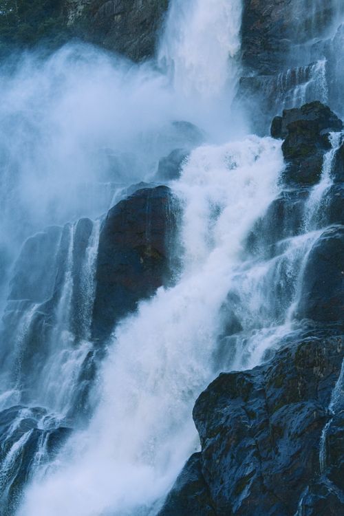 Free Powerful waterfall cascading down rocky cliffs in Arunachal Pradesh, India, showcasing nature's raw beauty. Stock Photo