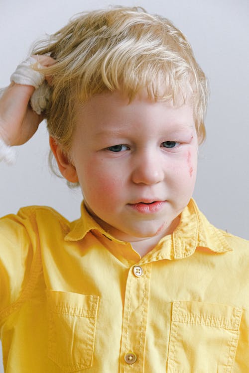 Boy In Yellow Button Up Shirt