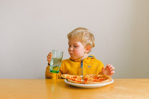 Free Boy Holding Clear Drinking Glass Stock Photo