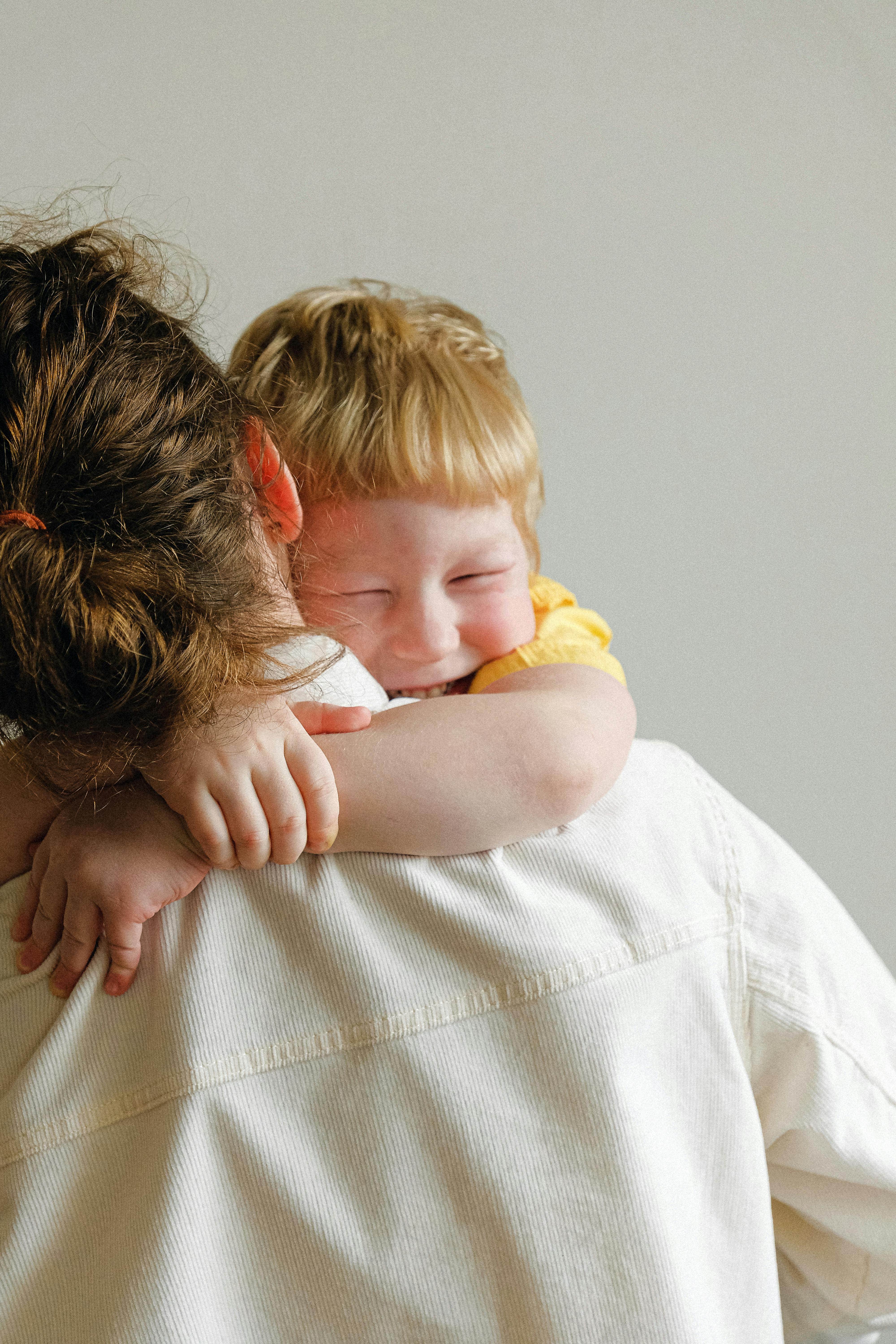 boy hugging his mom