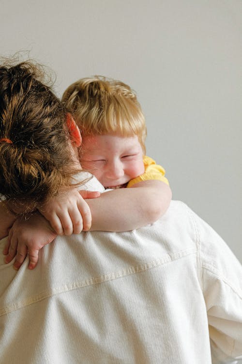 Boy Hugging His Mom