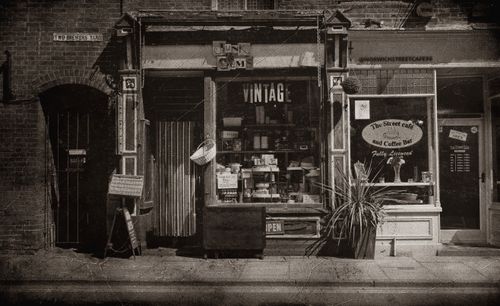 Free Classic monochrome shot of an old-fashioned storefront with vintage elements. Stock Photo