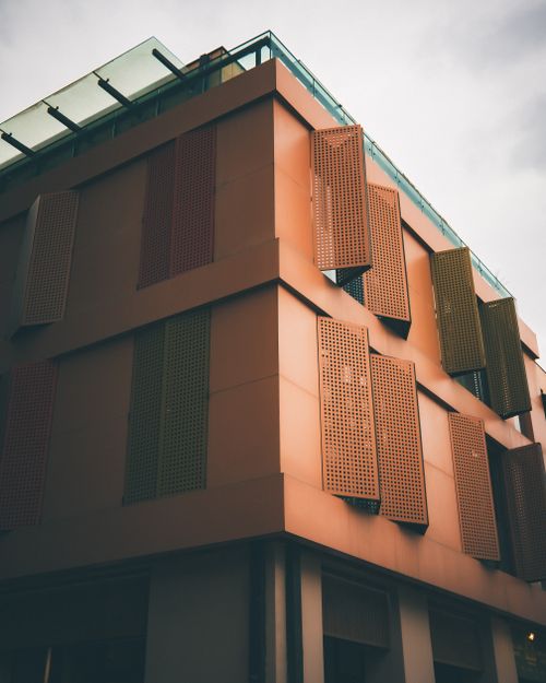 Free A contemporary building with a unique facade in Tbilisi, Georgia captured on a cloudy day. Stock Photo