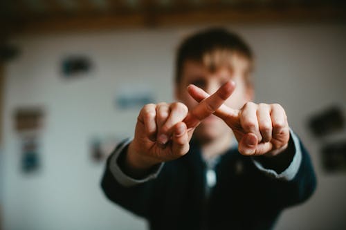 A Boy Showing His Fingers