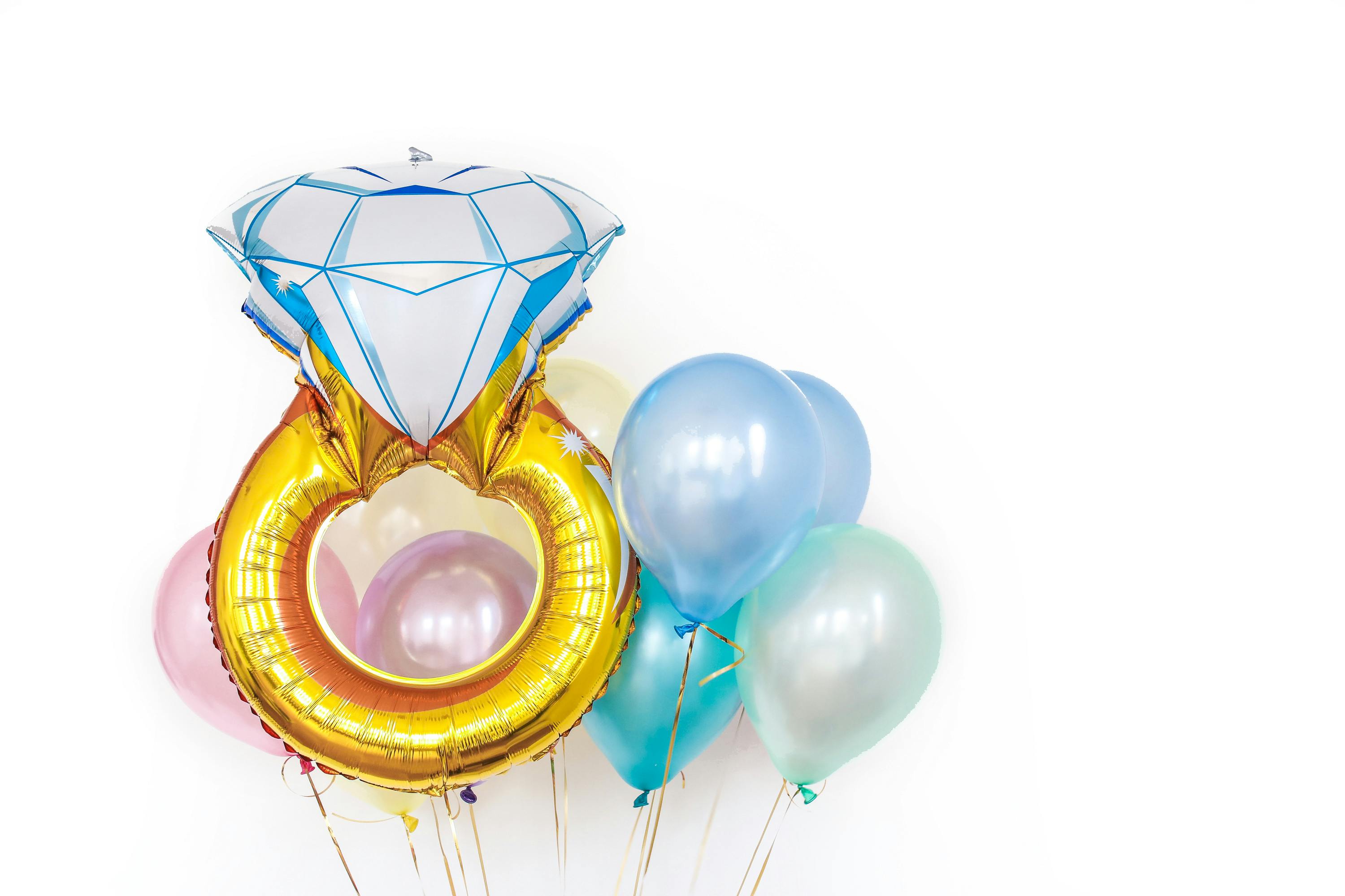 colorful glossy different shaped balloons in studio