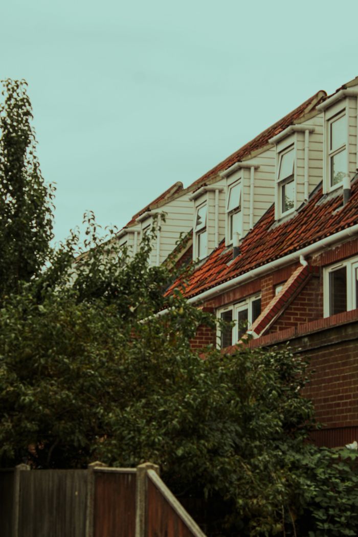 Illustrative view of a British brick terrace with replacement white windows
