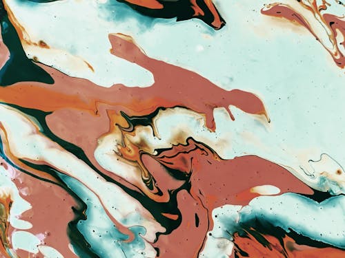 Abstract background of spills brown and turquoise paints