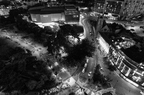 Free Stunning aerial view of central Bournemouth at night showcasing illuminated streets and architecture. Stock Photo