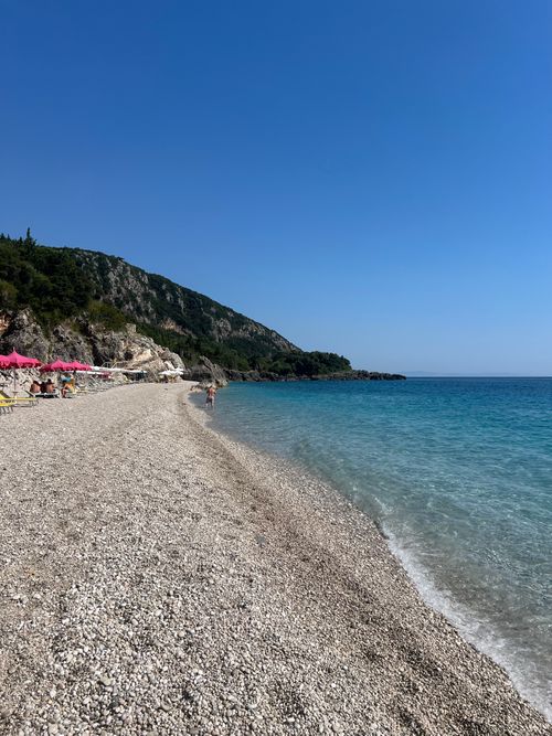 Free Beautiful sunny day at Himara Beach, Albania, with clear blue skies and scenic coastline. Stock Photo