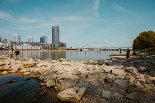 Urban riverfront and skyline, photo by Helena Jankovicova Kovacova on Pexels
