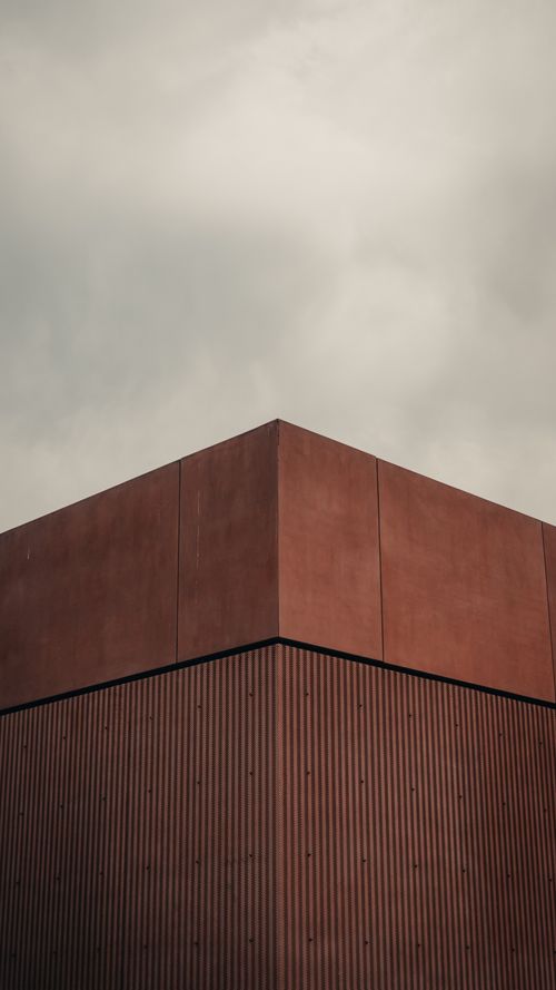 Free Explore the minimalist architecture of Warsaw with this dramatic, geometric building shot from below. Stock Photo