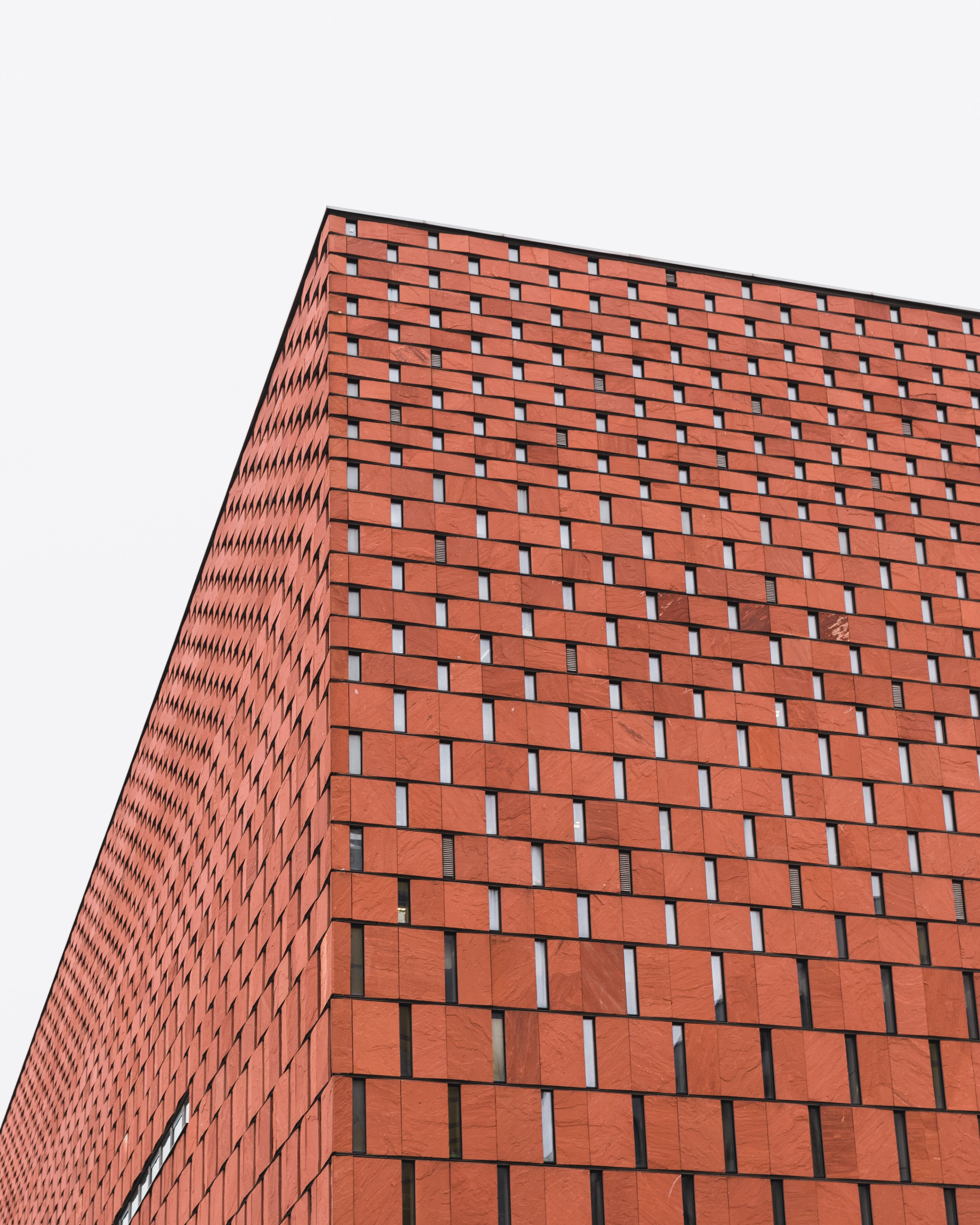 Modern minimalist brick building in Katowice, showcasing clean lines and minimal design.