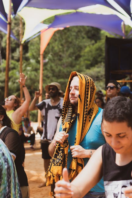 A lively summer festival scene with diverse people enjoying music outdoors.