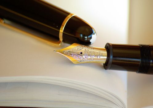 Closeup Photo of Blue Pen Tinted Spiral Notepad Placed Beside Pen Die Cast Car and Coffee Cup ...