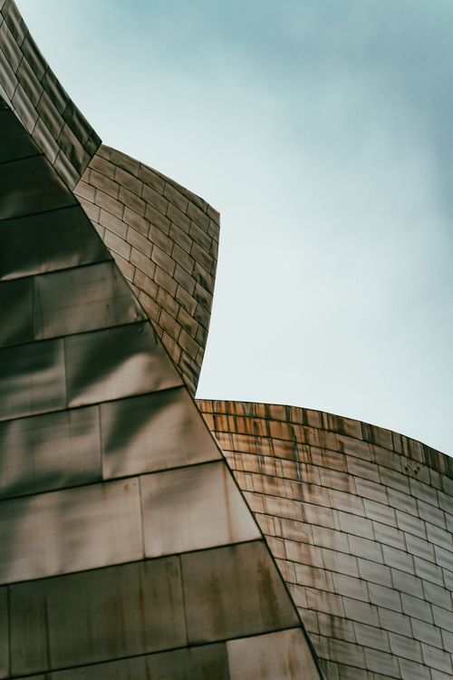 Free Close-up shot of the Guggenheim Museum's metallic facade in Bilbao, Spain. Stock Photo
