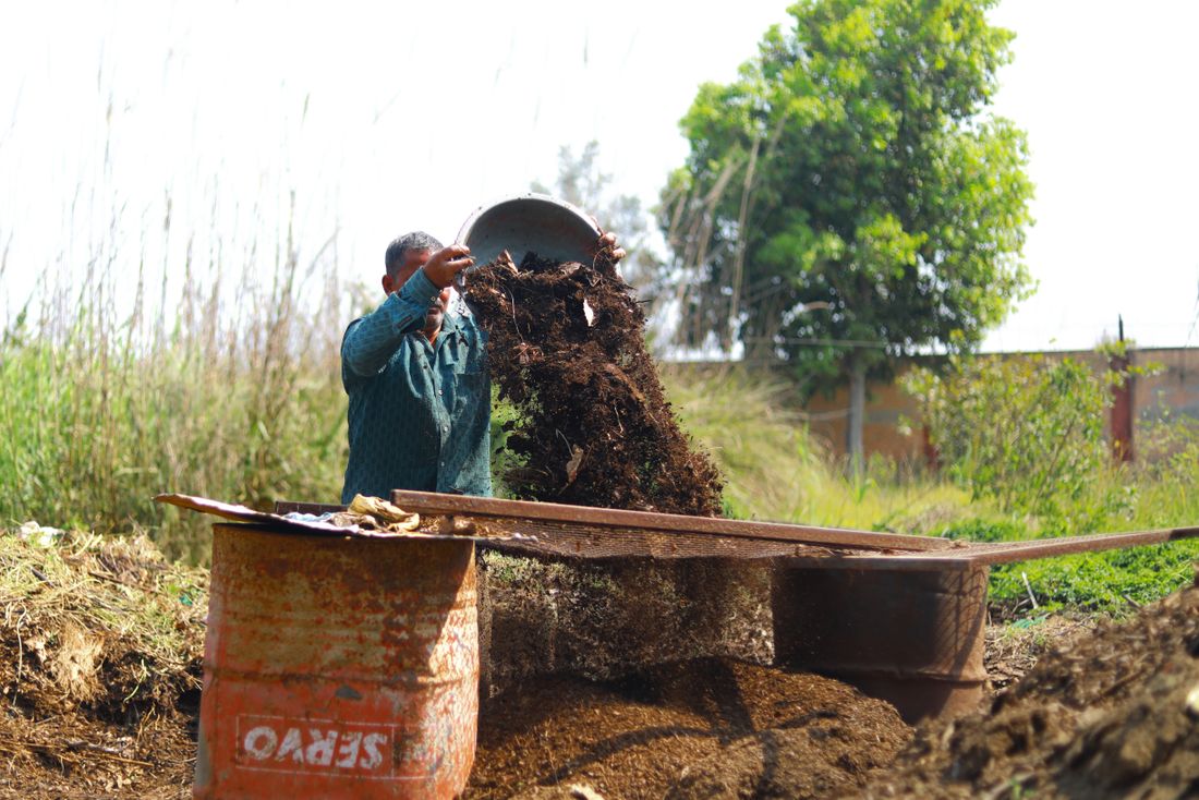 Finished compost being turned