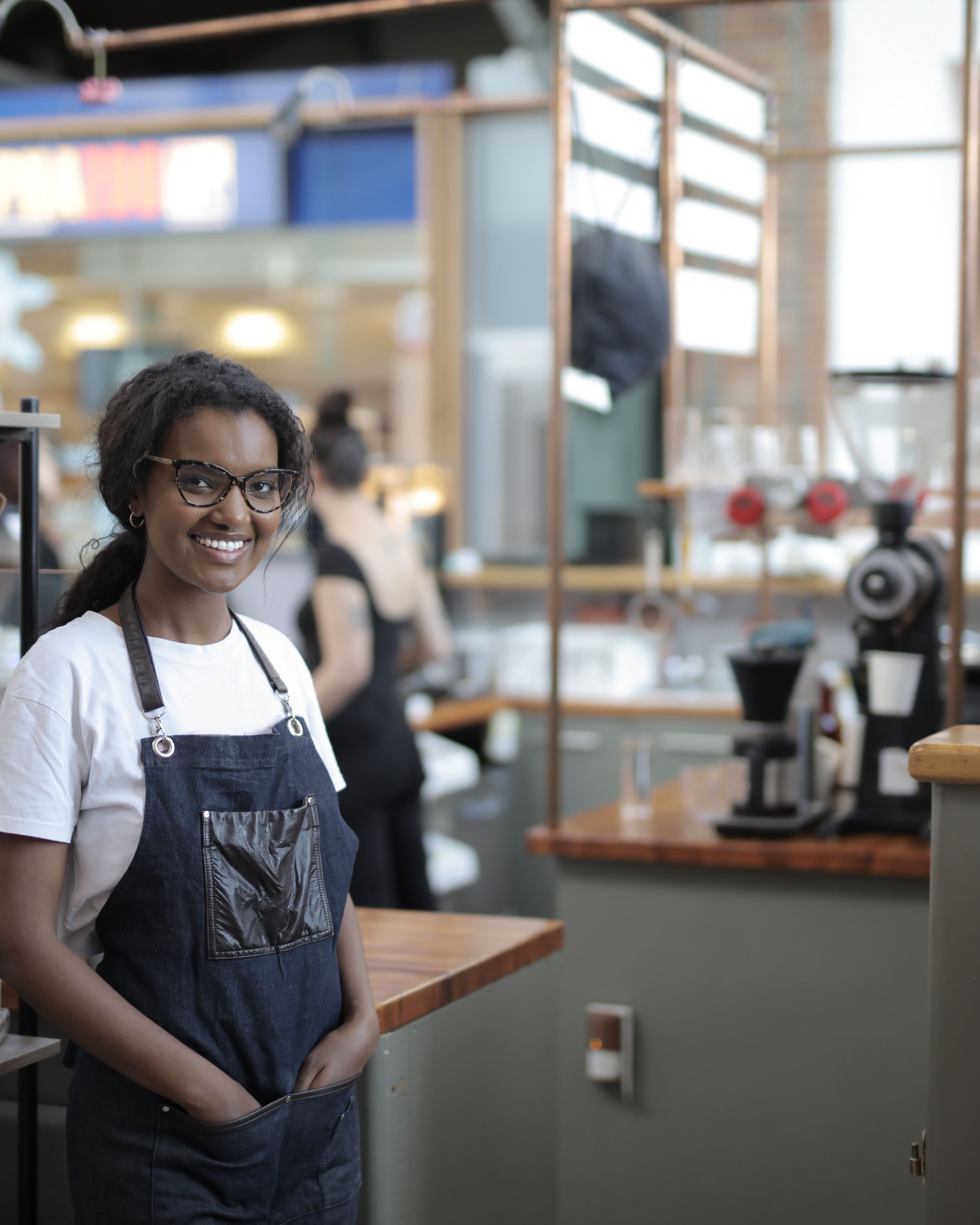 Barista smiling behind the counter