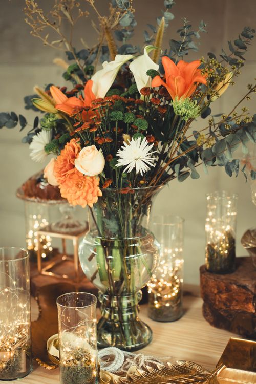 Free A beautiful floral arrangement with warm lighting, perfect for weddings or events. Stock Photo