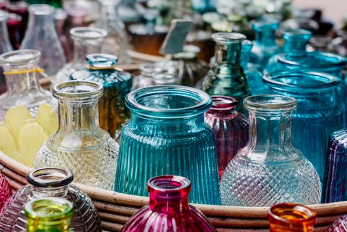 Free A vibrant assortment of colorful vintage glass bottles in various shapes and sizes. Stock Photo