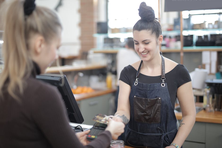 Woman Paying with Credit Card