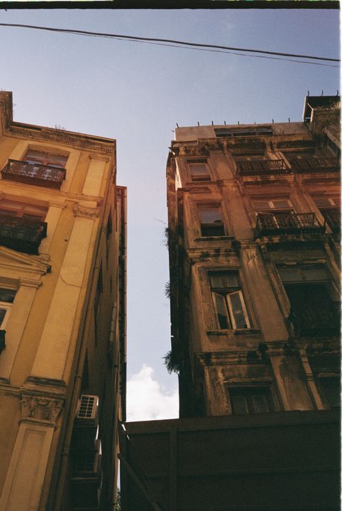 Free Upward view of vintage buildings in İstanbul against a clear sky. Stock Photo