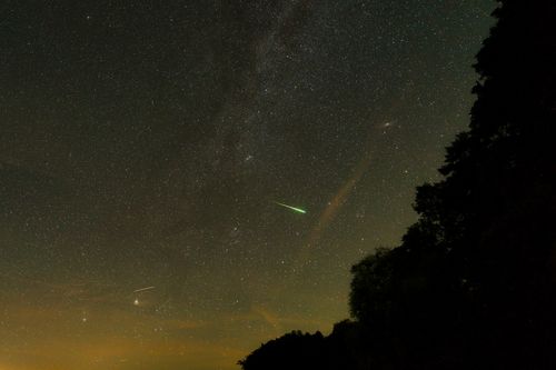 Free Captivating night sky over Stechlin, Germany, featuring a meteor shower under the starry expanse. Stock Photo