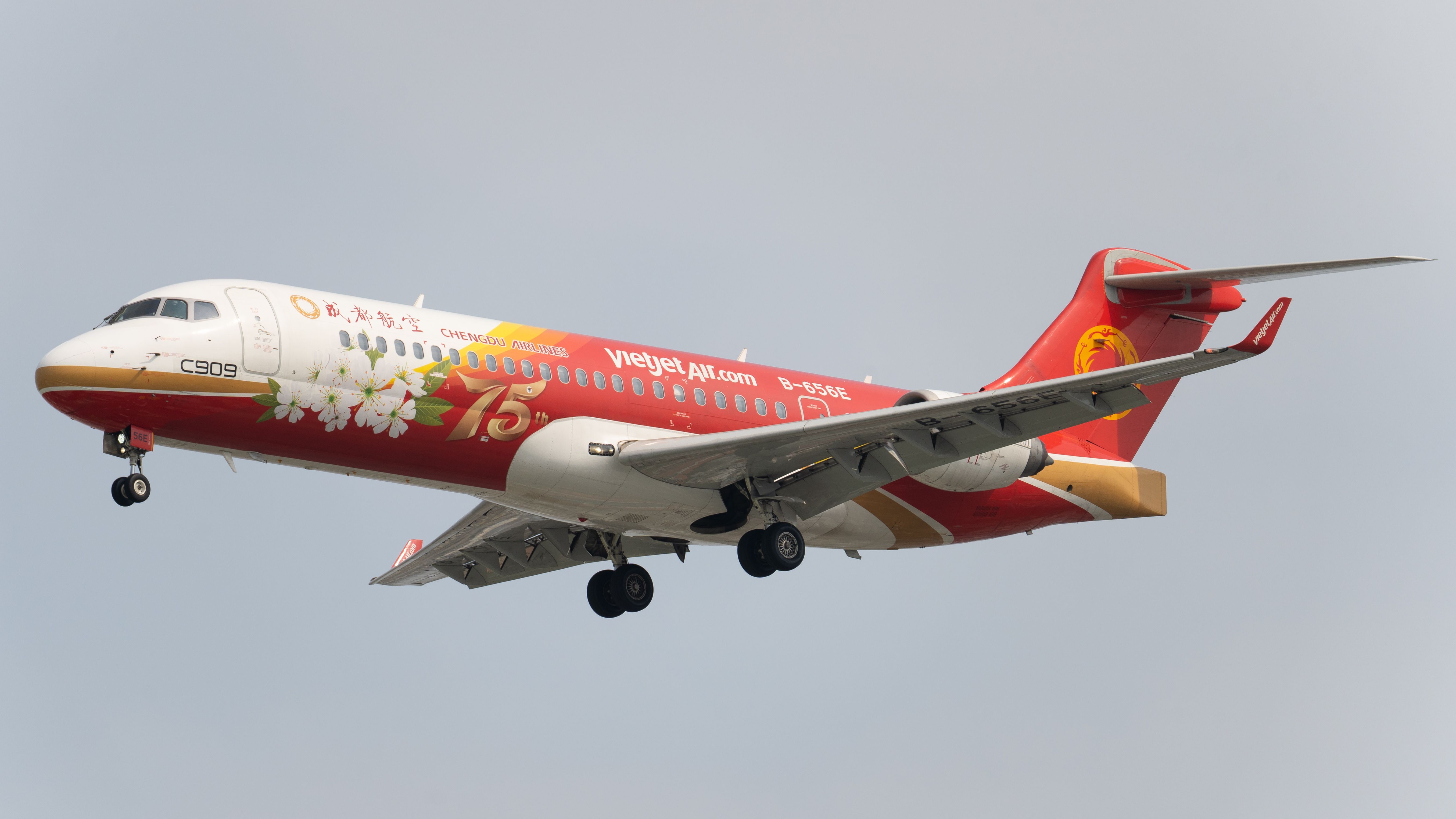 Chengdu Airlines jet with commemorative livery featuring cherry blossoms and anniversary theme.