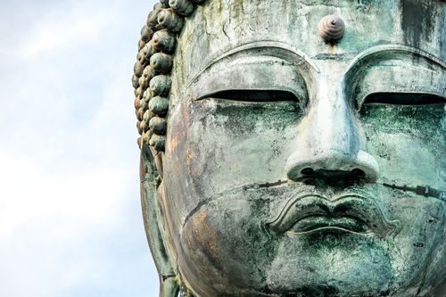 Free Detailed view of the serene face of The Great Buddha statue in Kamakura, Japan. Stock Photo