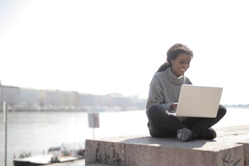 Woman Using Laptop Outdoors