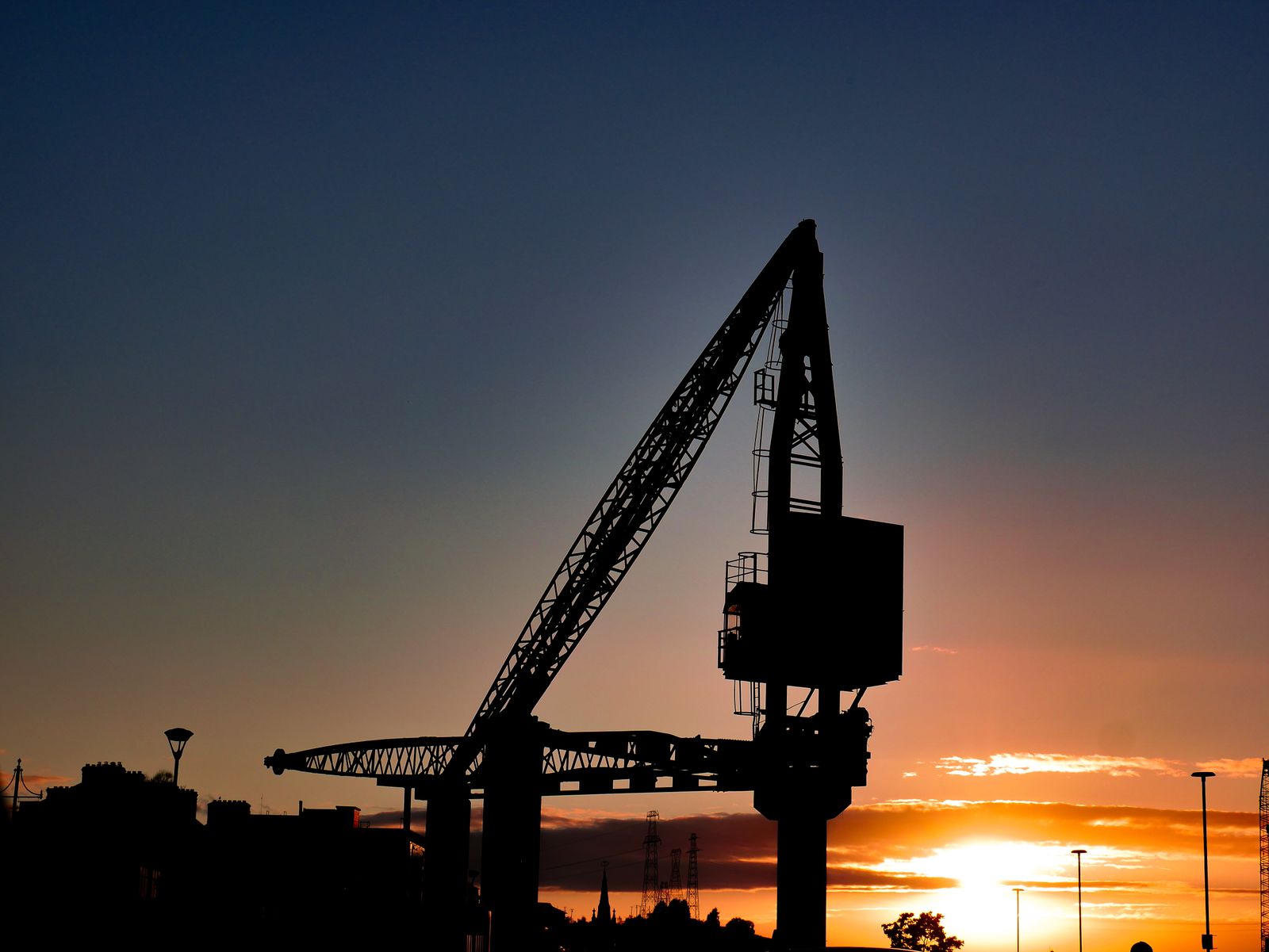 A striking image of a crane silhouetted against a sunrise in Waterford, Ireland