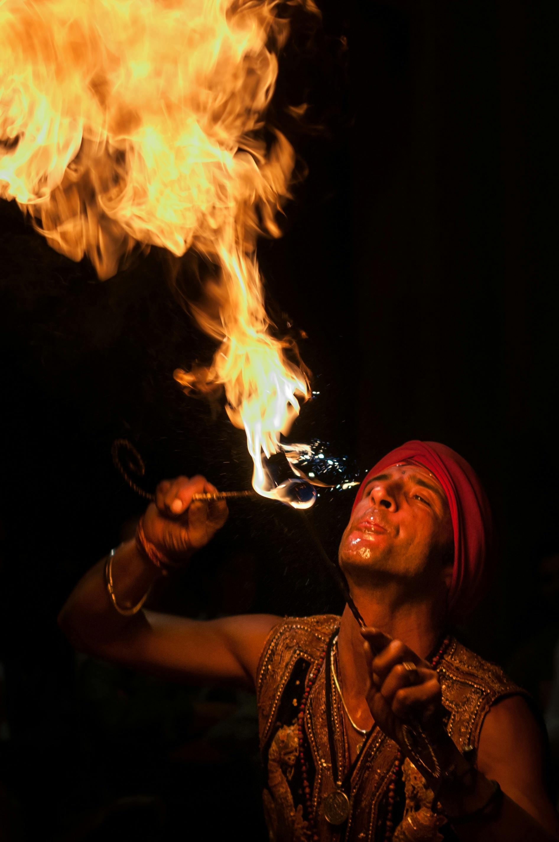 A man doing fire breath. | Photo: Pexels