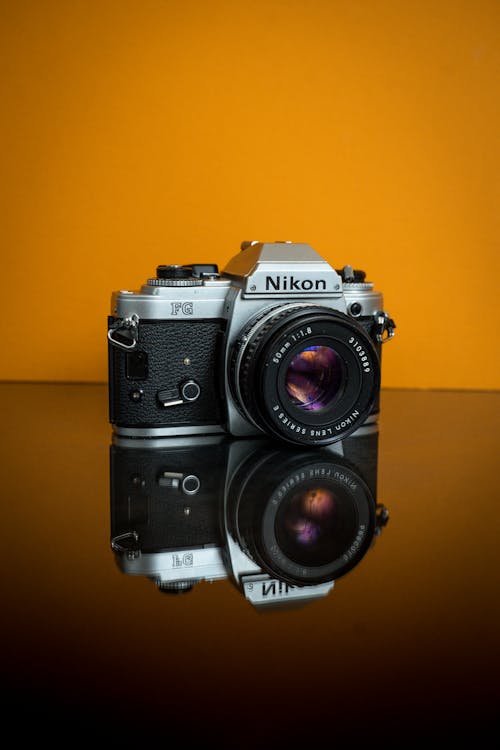 Free Black And Silver Nikon Dslr Camera Stock Photo