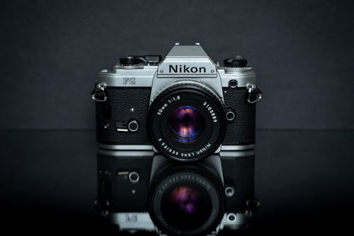 Black and Silver Nikon FG Camera