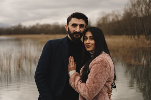 Free Couple Standing By The Lake Stock Photo