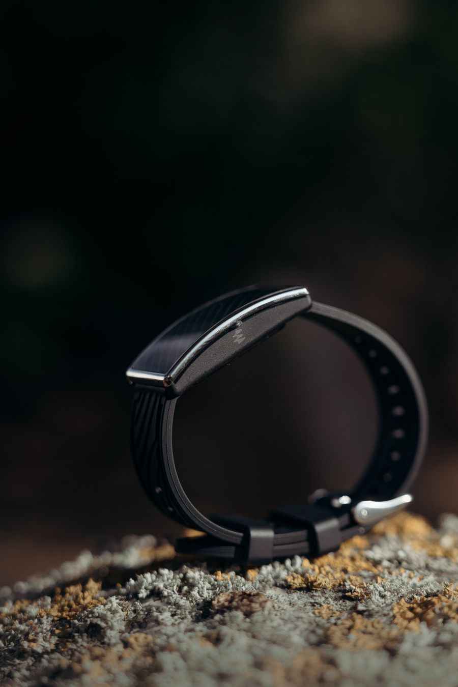 Black fitness band on a stone