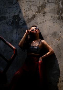 Dramatic urban fashion portrait with natural shadows in West Java.