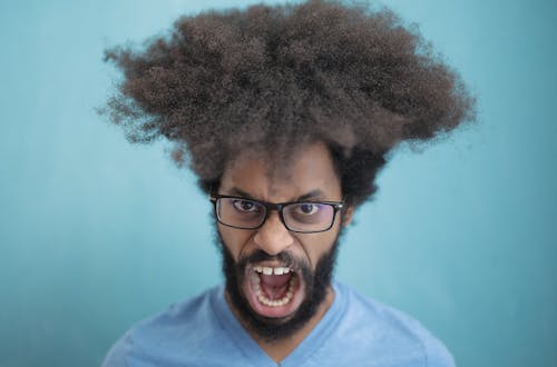 Man in Blue Crew Neck Shirt Wearing Black Framed Eyeglasses