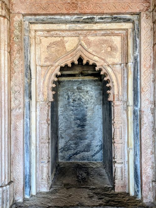 Free A beautifully carved stone archway showcasing historical architectural design in Mandav, India. Stock Photo
