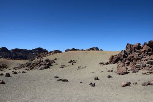 Free Scenic view of a barren rocky landscape with clear blue skies, ideal for nature exploration. Stock Photo