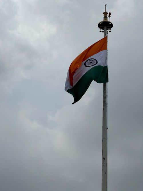 Free The Indian national flag waving proudly against a cloudy sky in Chandigarh, India. Stock Photo