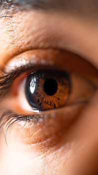 Macro shot highlighting the intricate details of a human eye with rich brown hues.