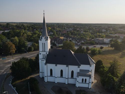 Free Aerial shot of a white church in Tiszavasvári, displaying Gothic architecture style. Stock Photo