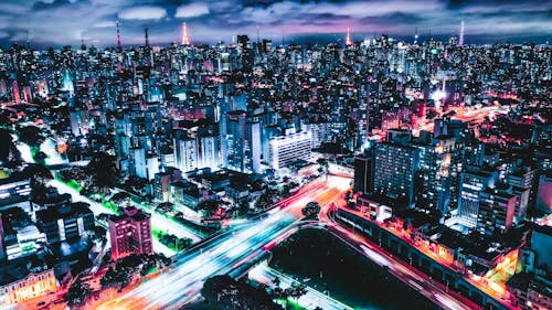 Free City Buildings During Night Time Stock Photo