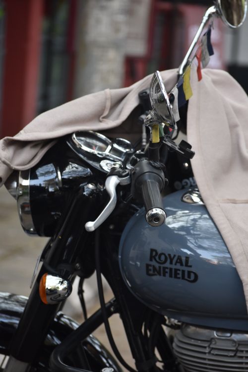 Free Detailed view of a Royal Enfield motorcycle with handlebars and tank visible. Stock Photo