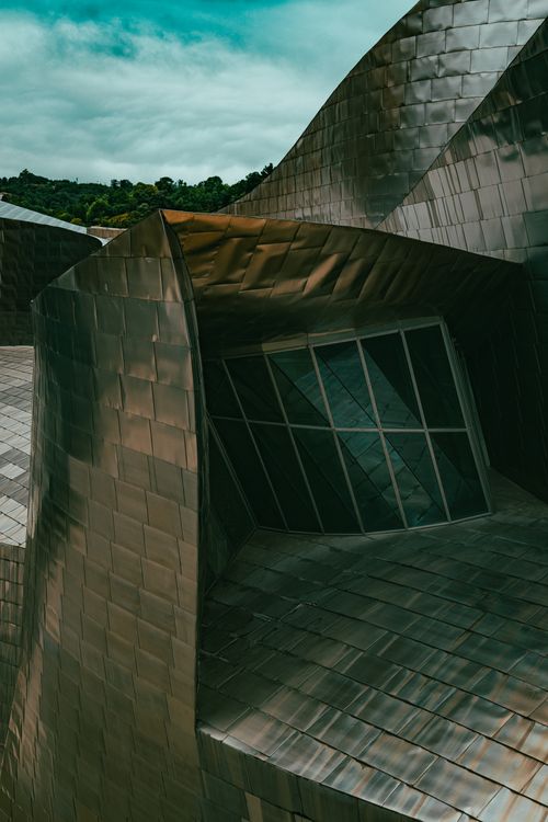 Free Modern architectural design of the Guggenheim Museum in Bilbao with reflective surfaces. Stock Photo