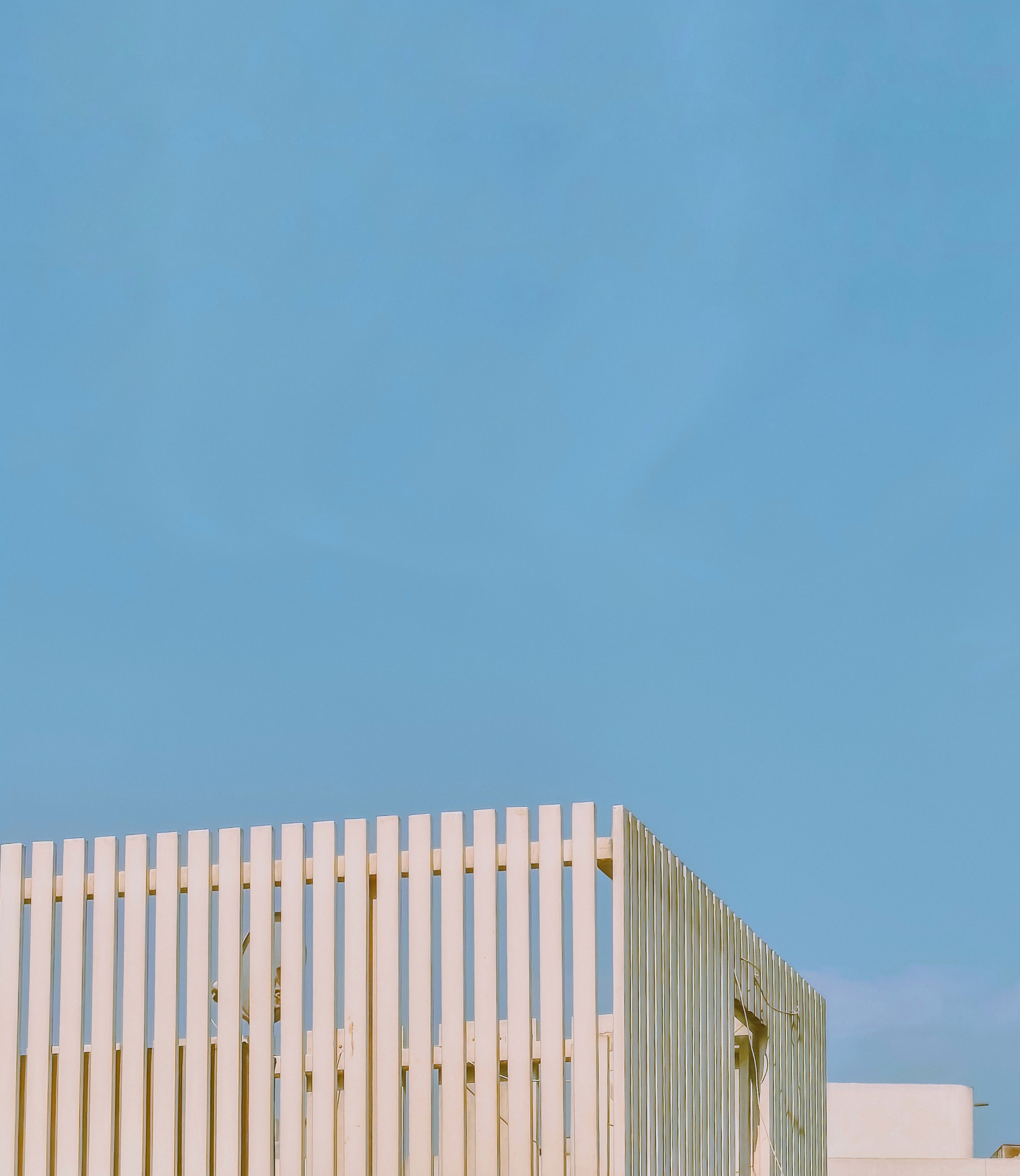 Minimalist architecture with a clean geometric design against a clear blue sky in Damanhour, Egypt.