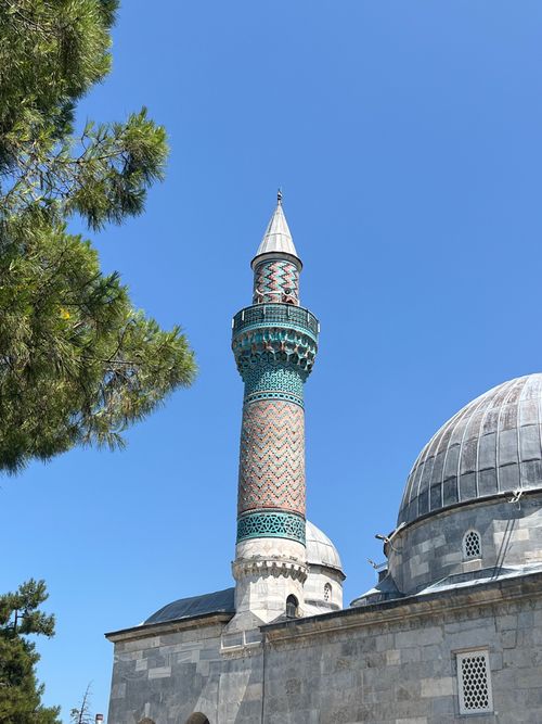 Free Detailed view of the beautiful Iznik Green Mosque minaret under a clear blue sky. Stock Photo