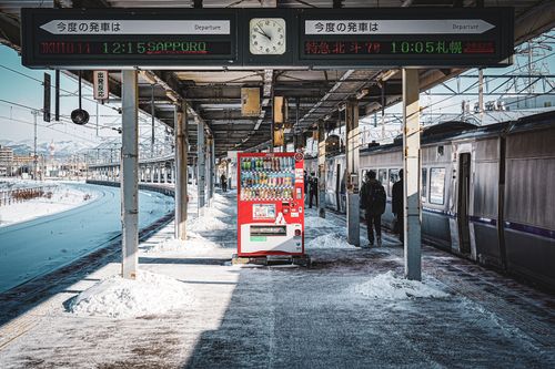 Free Vending machine on a snowy platform at Hakodate train station, Hokkaido, Japan in winter. Stock Photo